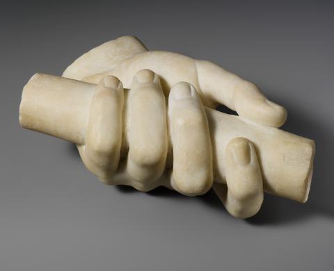 Marble left hand holding a scroll