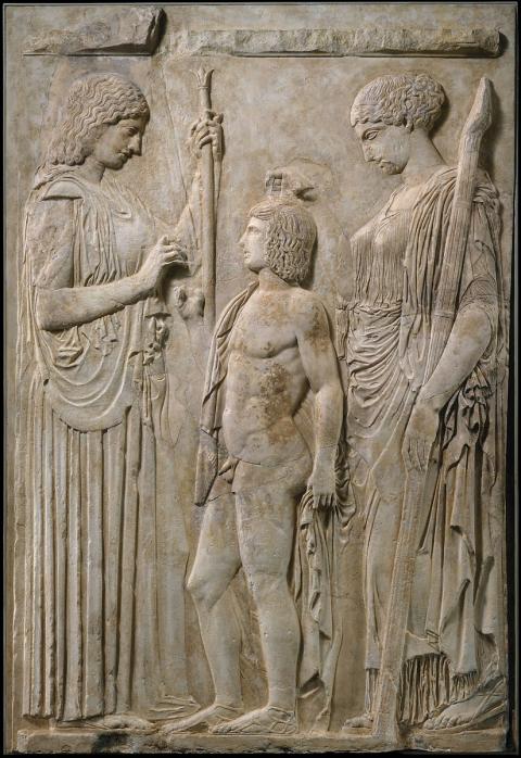 Goddess Demeter and her daughter Persephone give grain to Triptolemos and teach him the art of agriculture. Marble Relief from Eleusis. ca. 430 BCE. Roman copy. ca. 27 BCE – 14 CE. Photo courtesy of the Metropolitan Museum of Art.