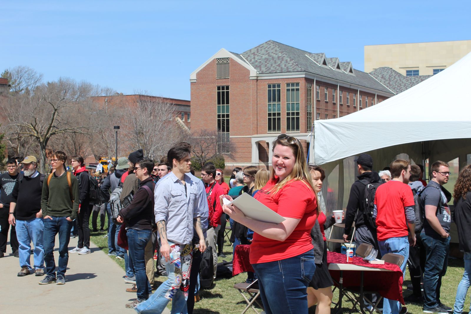 UNL Classics major Bekkah Watkins keeps track of the readers. Photo by Ellie Churchill and used by permission.