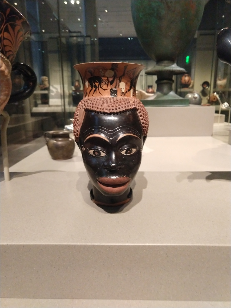Figure 2. Athenian plastic mug in the form of a black man’s head and face, ca. 510 BCE. Museum of Fine arts, Boston. Photo by Najee Olya who discusses his research on Greek painted vases representing Africans in the Peopling the Past blog.