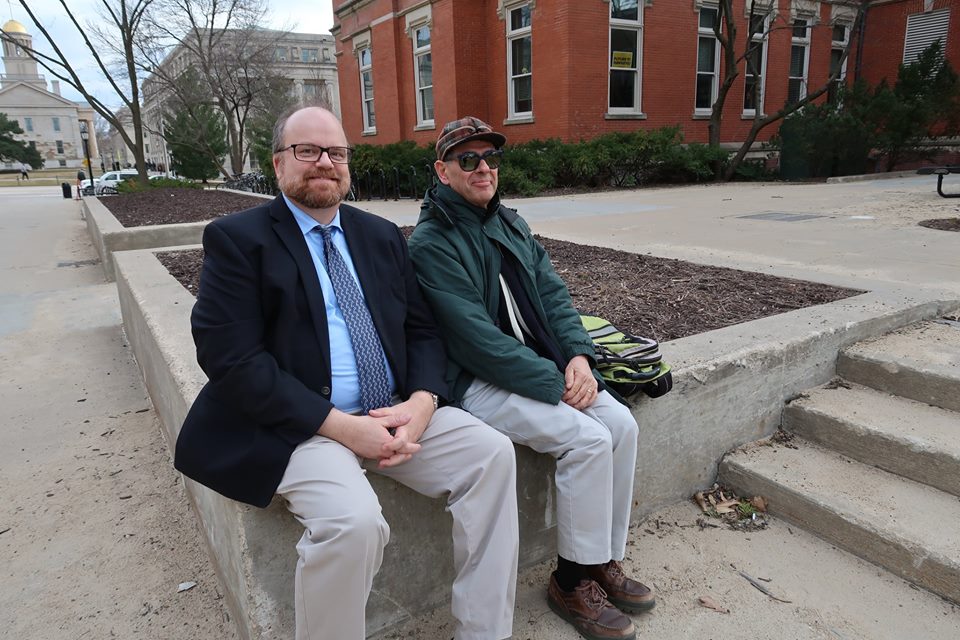 Classics professors, Craig Gibson and Glenn Storey, wait for their turn to read Homer.